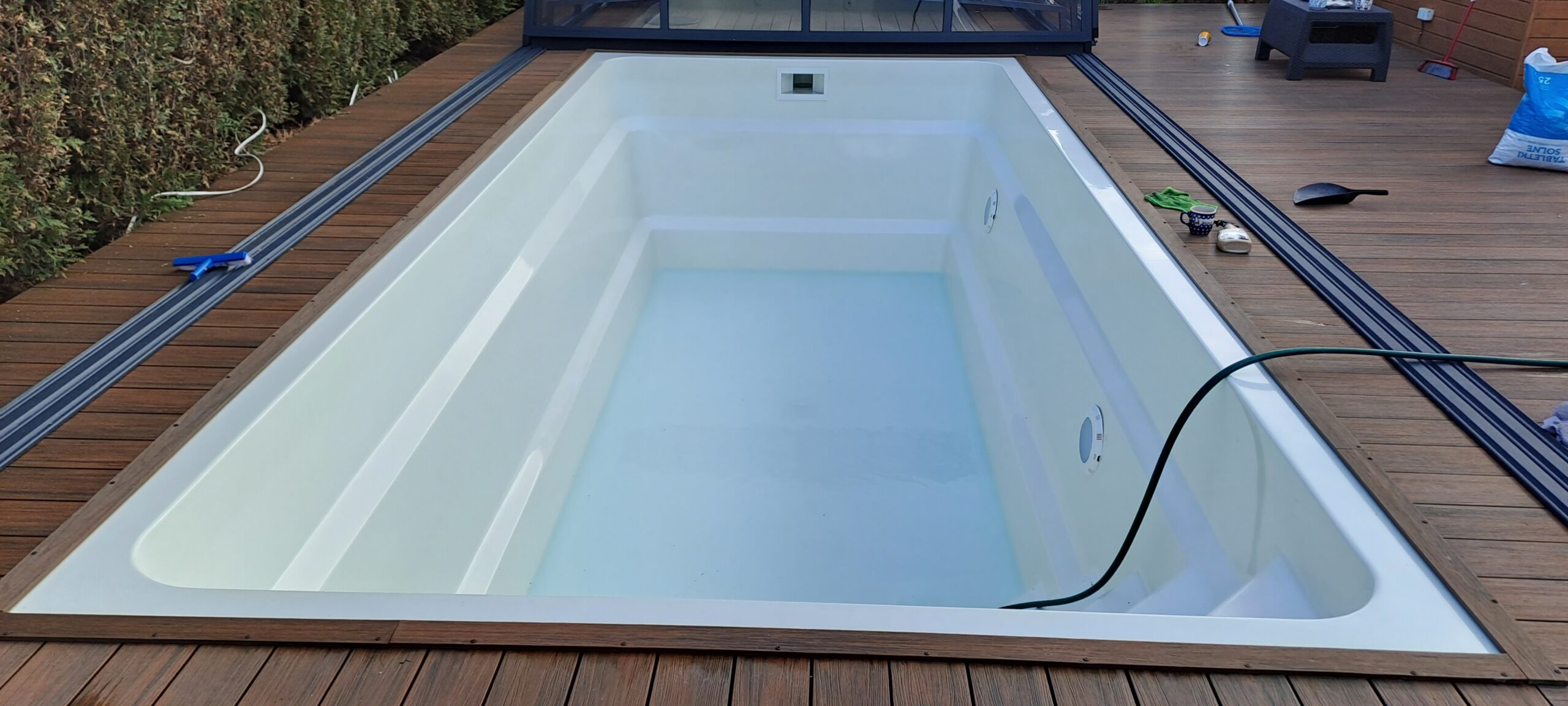 Filling the cleaned polyester pool with water