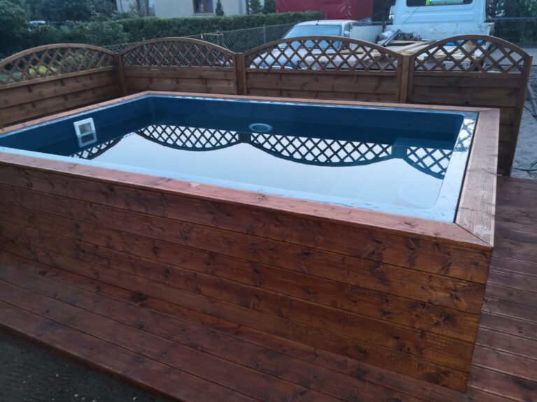 Fiberglass Bari pool from DreamPools installed as the semi - above the ground pool