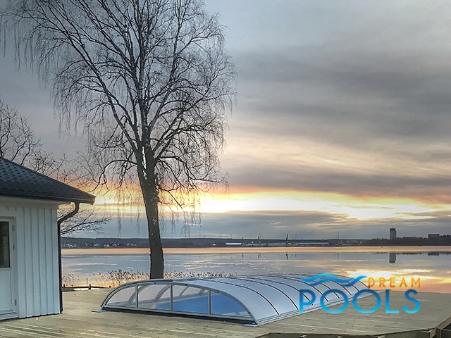 Fiberglass pool from DreamPools by the lake